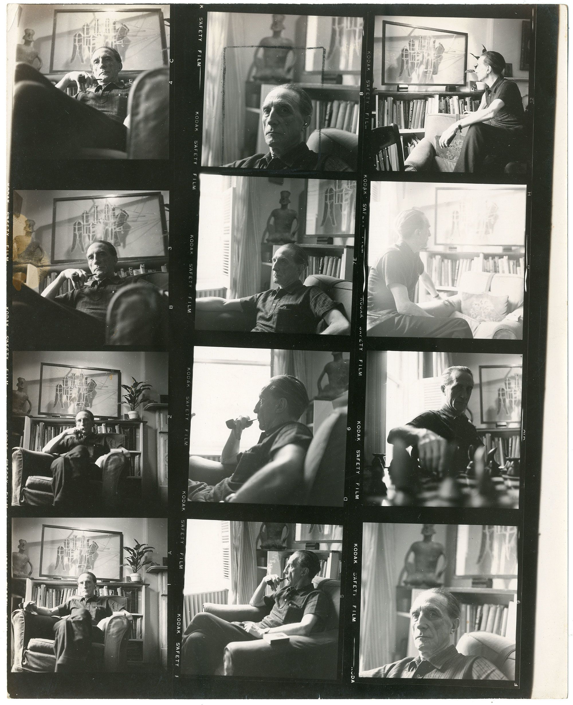 Monochrome film rolls featuring four images per strip, showing Marcel Duchamp seated in a living room. Behind him, there is a bookcase and an artwork on the wall. In one photo, Duchamp is playing chess.
