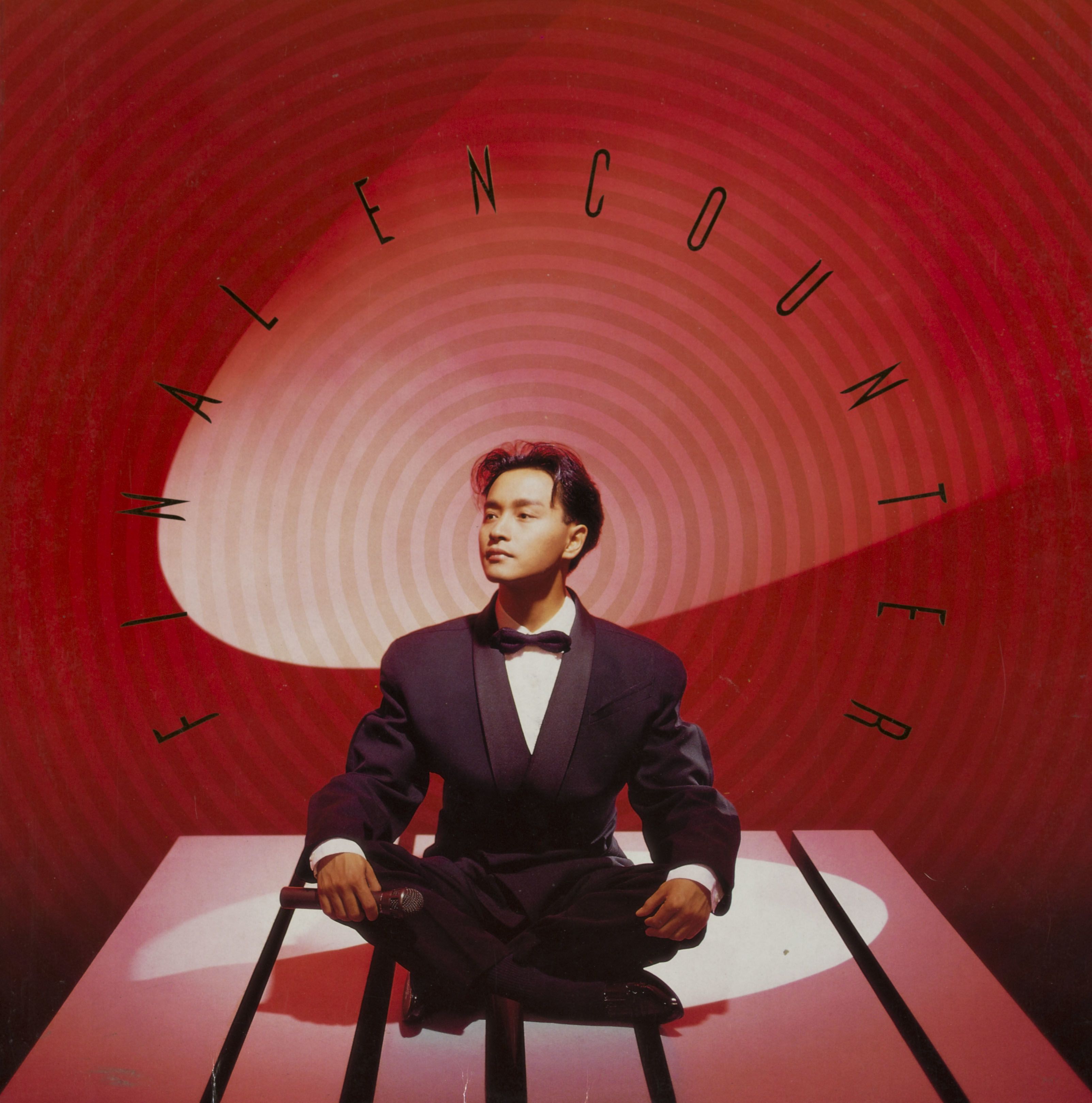 Cover of Leslie Cheung’s vinyl album Final Encounter. The red background is formed by concentric circles. The singer, wearing a suit, sits cross-legged on the stage. He holds a mic in his right hand, looking into the distance to his right.