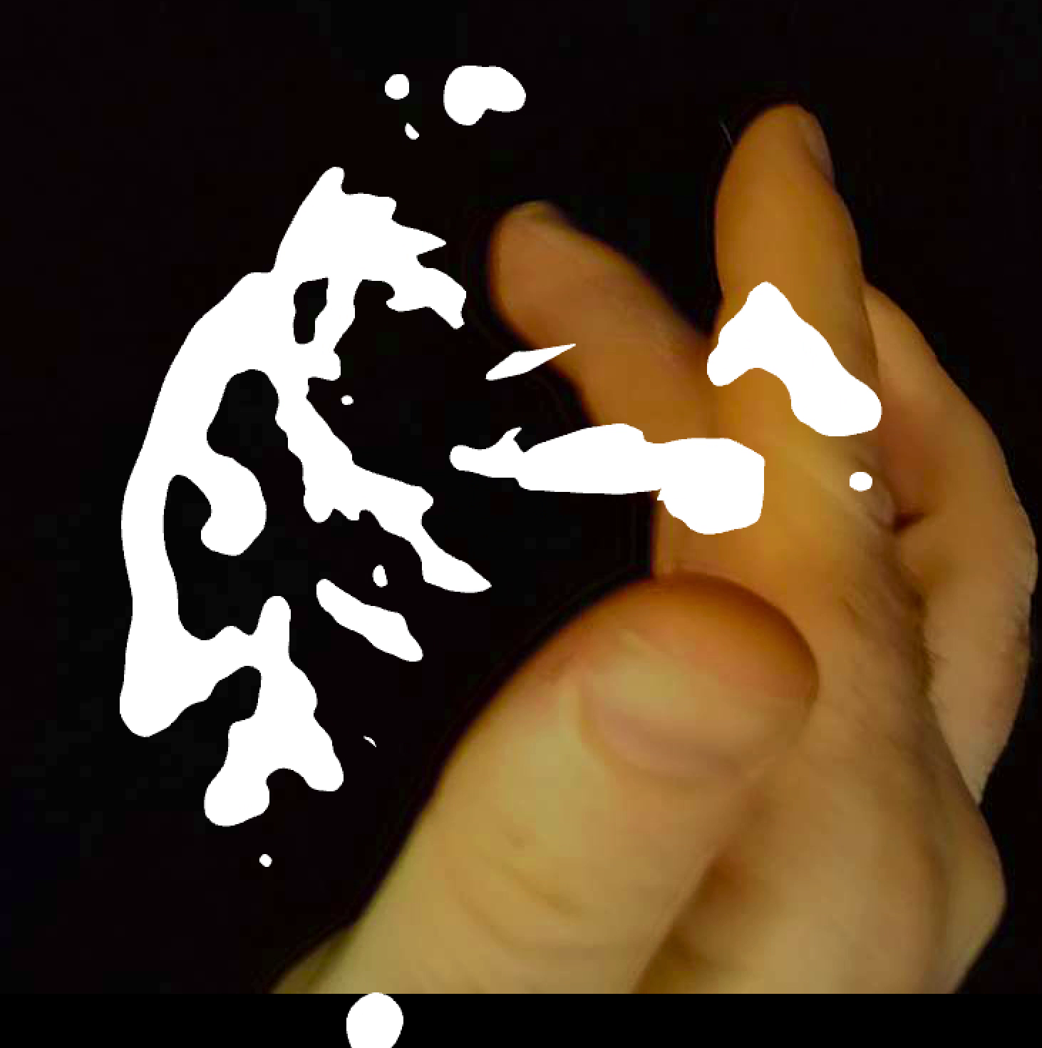 Fingers touching a white blob form against a black background.